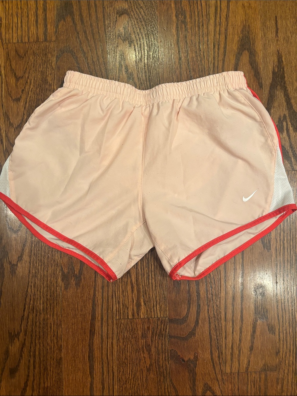 Nike Girl’s Light Pink Athletic Shorts with Red Trim